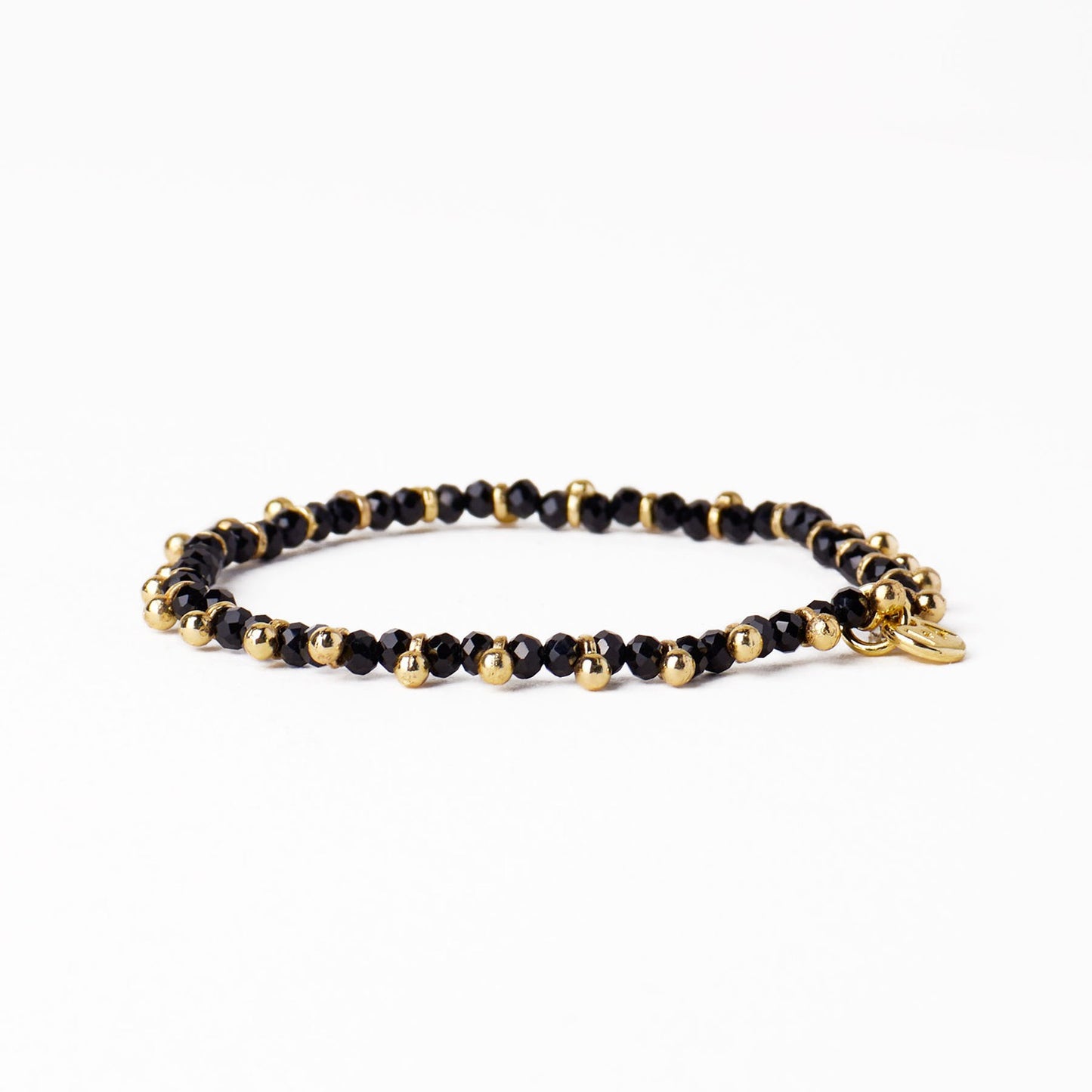Kami Crystal + Brass Charm Stretch Bracelet in Black + Gold by Ink & Alloy