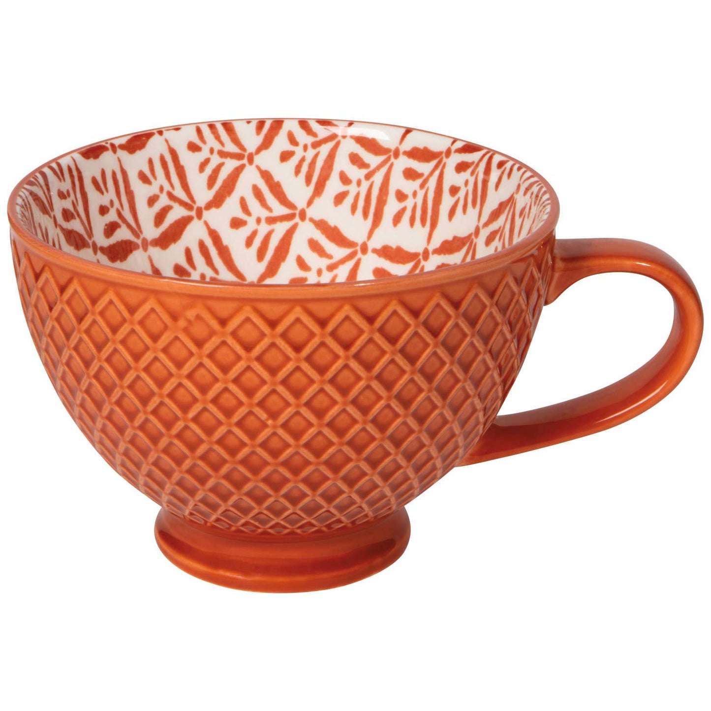 Orange textured mug with white patterned interior on a white background